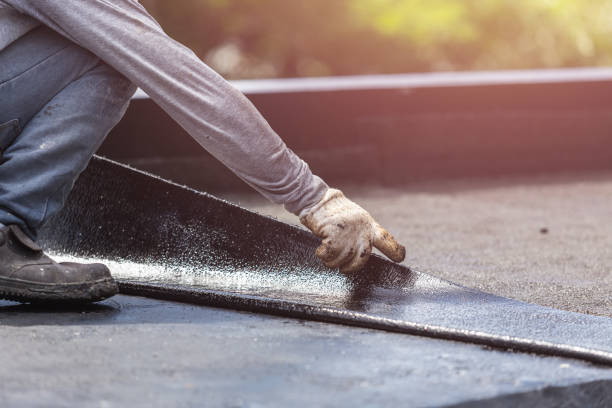 Professional Basement Waterproofing technician working in Parrish, AL